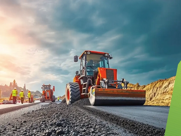 Road roller compacting fresh asphalt during road works
